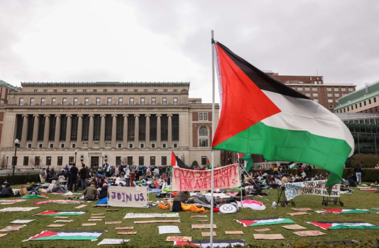 Palestine Protests sign that reads "Encampment Action Stand With Us. Say No Stand for Palestine"